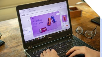 Person using laptop to use Wix's website editor