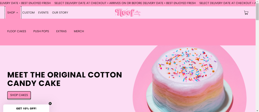 Colorful cotton candy cake with sprinkles showcased on an Floof's website.
