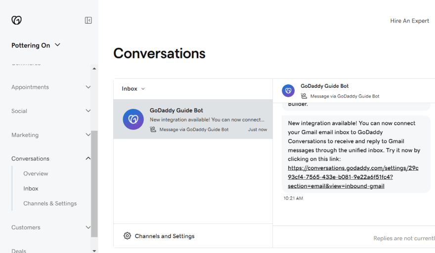 GoDaddy Conversations dashboard showing the unified inbox with a message from GoDaddy Guide Bot