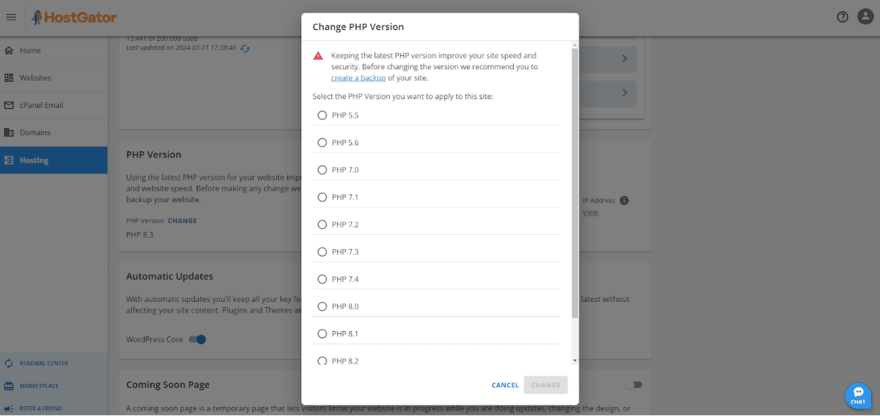 HostGator control panel with an overlay to change the PHP version, advising to keep PHP updated for speed and security and to back up the site before changes.