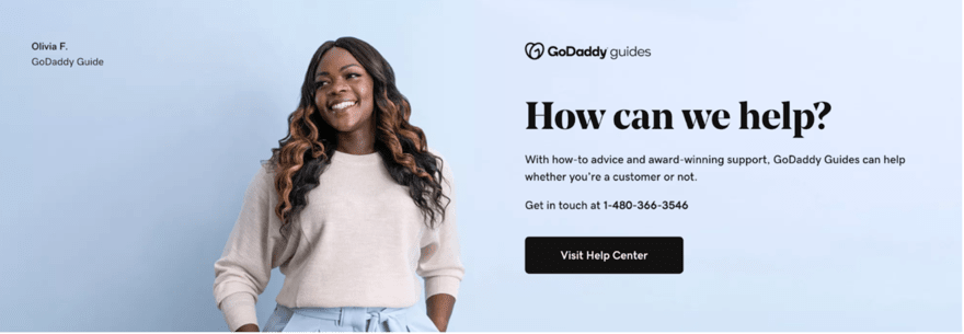 GoDaddy's customer support page banner featuring a smiling representative with the text "How can we help?" and contact information for assistance.